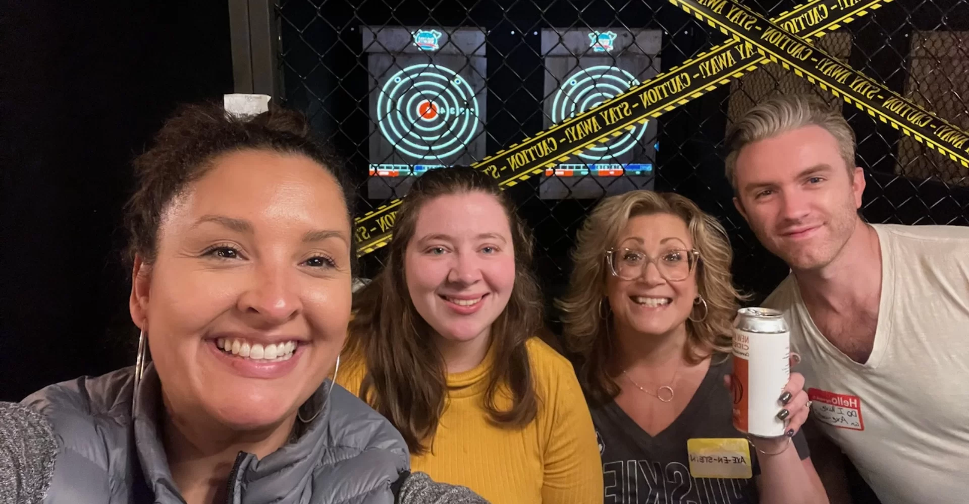 HRP employees at an axe throwing range