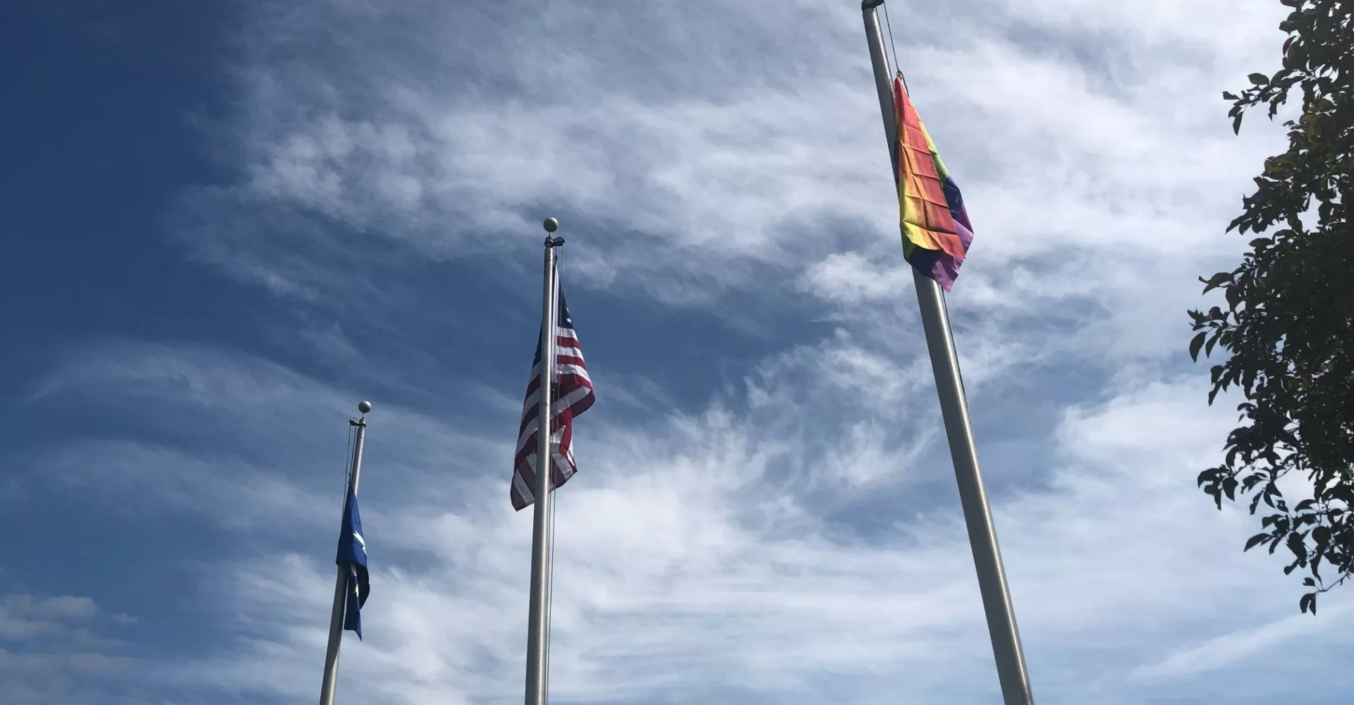 3 flags on flagpoles