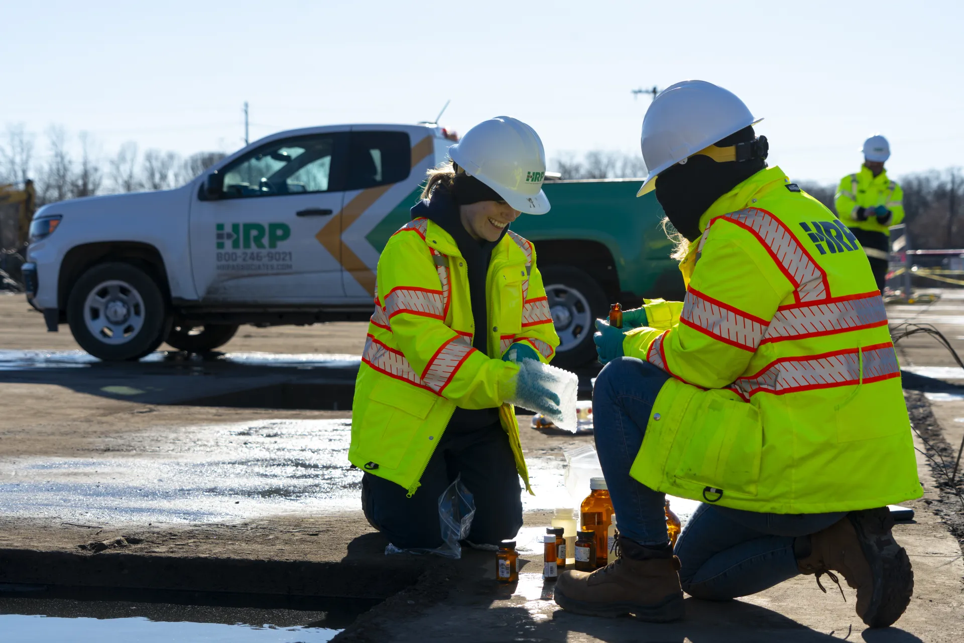 HRP employees loading a van with food donations