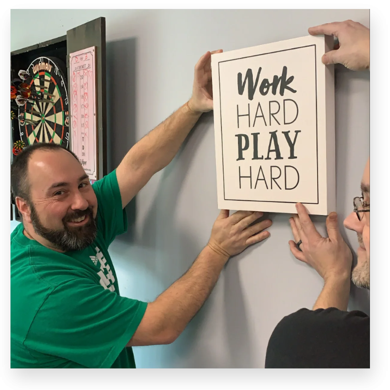 HRP founders holding sign that says Work Hard, Play Hard